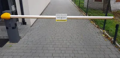 a sign on a railing on a sidewalk with a walkway at Apartamenty Salt Delux in Wieliczka