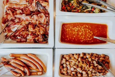 four different plates of food with different types of food at Grand Ascot Hotel in Kraków