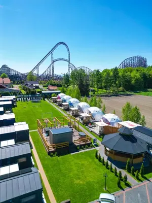 an aerial view of an amusement park with a roller coaster at Holiday Park Zator in Zator
