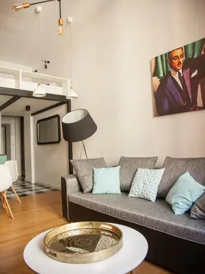 a living room with a couch and a table at BC7 Apartments in Kraków