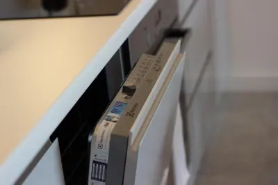 a nintendo wii controller sitting on a shelf at Lenzo Apartments in Kraków
