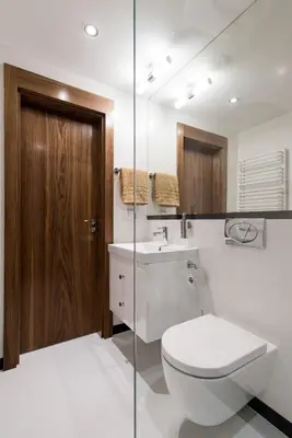a bathroom with a toilet and a sink at Apartament nad dachami Krakowa in Kraków