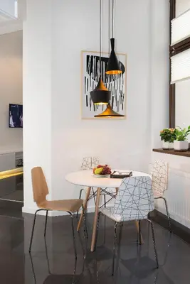a dining room with a table and chairs at Art Room Boutique Apartment in Kraków