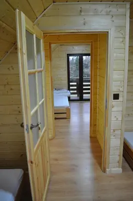 an open door to a room with two beds at U Kazika w górach in Ślemień