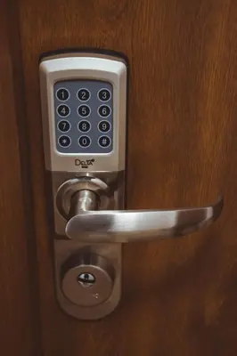 a door handle with a remote control on it at Stawowa Premium Apartment - 69 m2 with sauna and private garage in Kraków