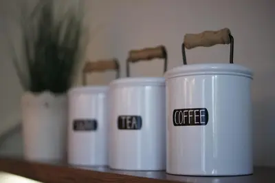 a row of white coffee cups sitting on a table at Cichy apartament w centrum Krakowa Salwator in Kraków