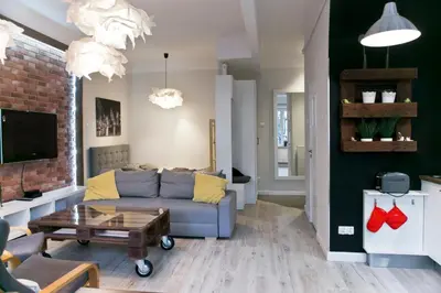 a living room with a couch and a coffee table at Cichy apartament w centrum Krakowa Salwator in Kraków