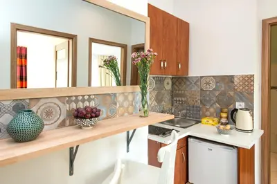 a kitchen with a sink and a counter top at Blue Sky Apartment in Kraków
