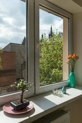 a window with a view of a city at Blue Sky Apartment in Kraków