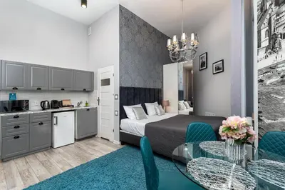 a small apartment with a bed and a kitchen at Z14 Boutique Residence - Krakow Old Town in Kraków