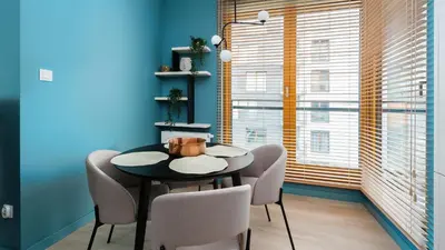 a dining room with a table and chairs and a window at Premium in Novum City Center, Sun & Snow in Kraków