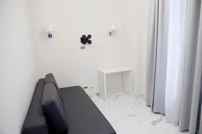 a living room with a couch and a table at Elegant City Center Zyblikiewicza 14 in Kraków