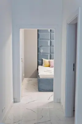 a bedroom with a bed in a doorway at Elegant City Center Zyblikiewicza 14 in Kraków