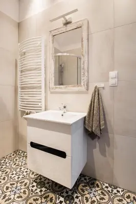 a bedroom with a bed and a brick wall at Delis Apartments - Dluga Street 11/3 in Kraków