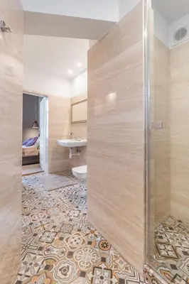 a shower with a glass door in a bathroom at Delis Apartments - Dluga Street 11/3 in Kraków