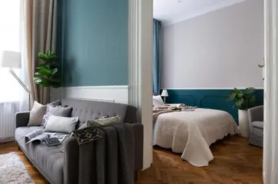 a living room with a couch and a bed at Between Old Town and Kazimierz in Kraków