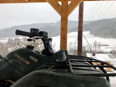 a close up of a snowmobile parked in a cabin at Malinowy Domek in Młyńczyska