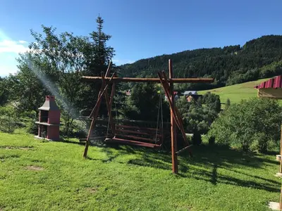 a irrigation system in a field with a sprinkler at Malinowy Domek in Młyńczyska