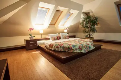 a bedroom with a large bed in a room at Chochołowy Dwór in Jerzmanowice