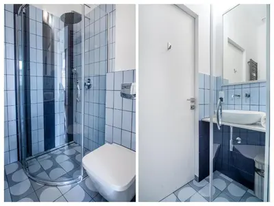 two pictures of a bathroom with a toilet and a sink at MB Cracow Apartments in Kraków