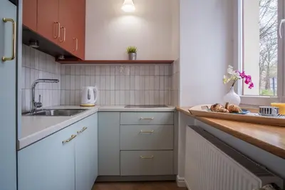 a living room with a couch and a table at MB Cracow Apartments in Kraków