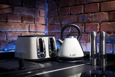 a white and black toaster sitting on a kitchen counter at Home far from Home in Kraków