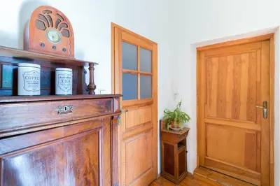 a room with a wooden cabinet and a door at Szeroka 33 D-F by Homeprime in Kraków