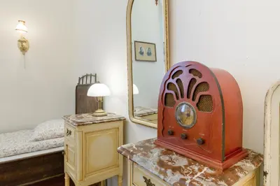 a bedroom with a bed and a mirror at Szeroka 33 D-F by Homeprime in Kraków