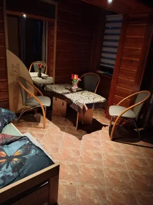 a room with chairs and a table and a table and chairs at Agroturystyka pod Pstragiem in Zawoja