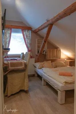a bedroom with two beds and a window at Agroturystyka Nad Jeziorem-Osada Indiańska in Czchów