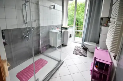 a bathroom with a shower and a sink and a toilet at Apartament Krych in Rabka
