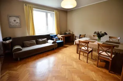 a living room with a couch and a table at Apartament Krych in Rabka