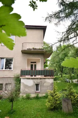 a building with a balcony on the side of it at Apartament Krych in Rabka