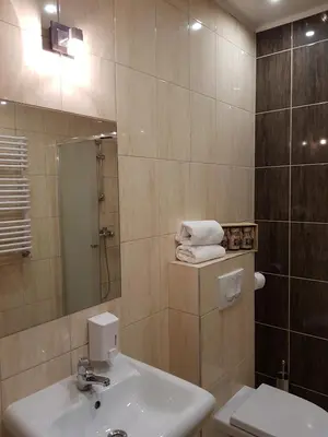 a bathroom with a sink and a toilet and a mirror at Pokoje Bakos Radocza in Radocza