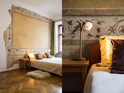 a hotel room with two beds and a window at Nicholas Studio in Kraków