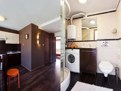 a kitchen and a bathroom with a washer and dryer at Irish Apartment in Kraków