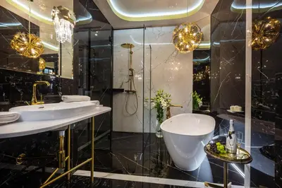 a bathroom with two sinks and a tub and a shower at Feniks Fragola Apartments in Kraków