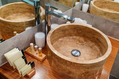 a bathroom with a wooden counter with a sink at Apartamenty Straszewskiego in Kraków