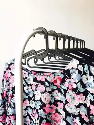 a pair of shorts on a clothes rack at Przestrzenny apartament w centrum Krakowa. in Kraków