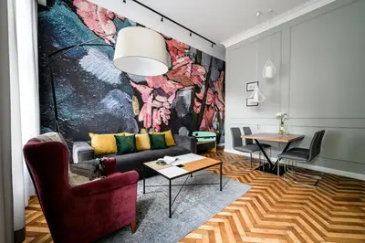 a living room with a couch and a table at Arts Apartments - Kraków Old Town in Kraków