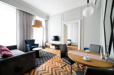 a living room with a couch and a table at Arts Apartments - Kraków Old Town in Kraków