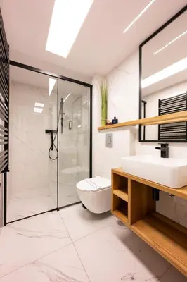 a bathroom with a toilet and a sink and a shower at Arts Apartments - Kraków Old Town in Kraków