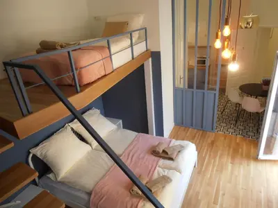 a bedroom with two bunk beds in a room at Apartamenty Rudi in Kraków