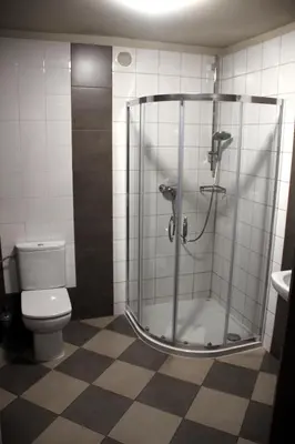 a bathroom with a shower and a toilet at Dom Gości Opactwa Benedyktynów in Tyniec