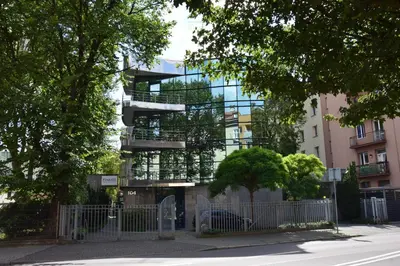 a building with balconies on the side of a street at NOOK NOOK Apartments Kazimierza Wielkiego 104 in Kraków