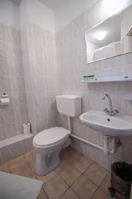 a bathroom with a toilet and a sink at Hotel Felix in Kraków