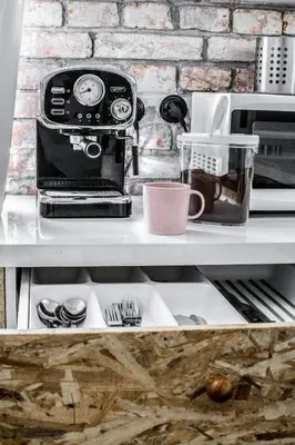 a coffee maker sitting on top of a shelf at LION apartments - Gold in Kraków