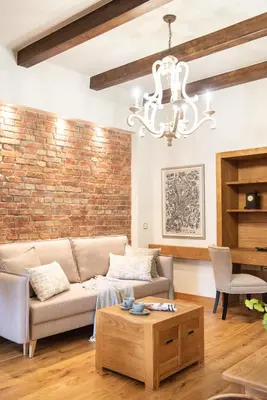 a living room with a couch and a table at Krakowhomes in Kraków