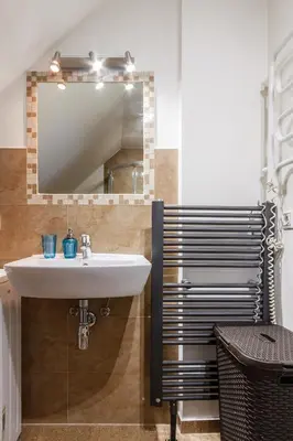 a bathroom with a sink and a mirror at Bronowice in Kraków