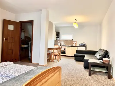 a living room with a couch and a table at Bronowice in Kraków
